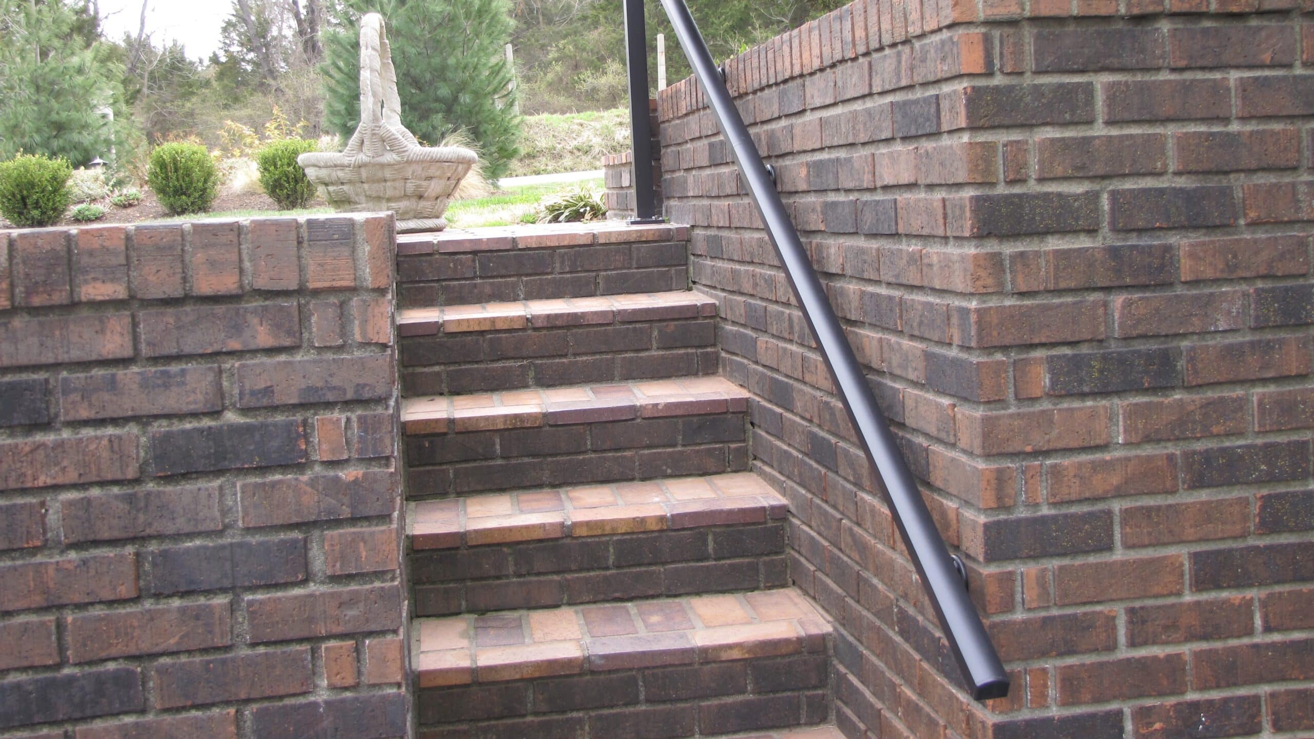 AHD aluminum railing on the side of brick steps