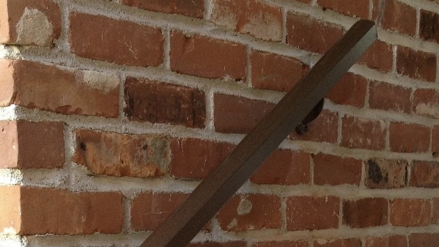 Aluminum Handrail Direct railing installed on brick wall