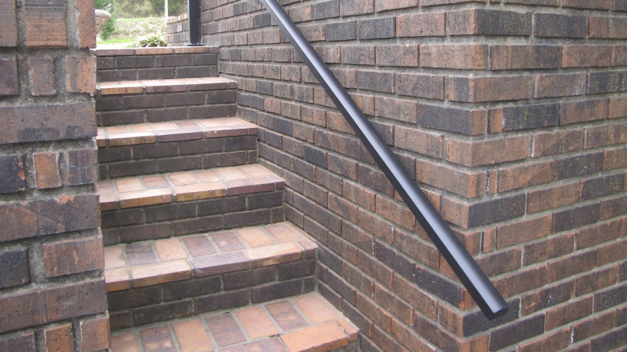Aluminum Handrail Direct handrail on brick wall beside stairs