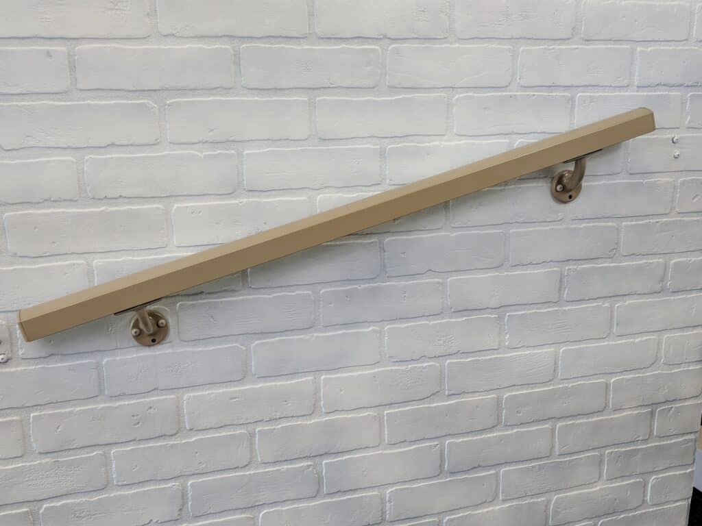 AHD Clay-Colored Aluminum Handrail on White Brick Wall